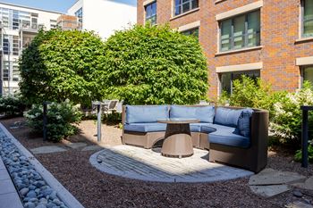 Seating area with a couch and a table in a courtyard